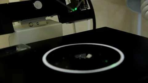 The doctor examines the sperm samples under a microscope. Stock Footage 76365528