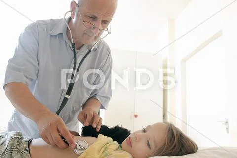 Doctor Examining Girl With Stethoscope
