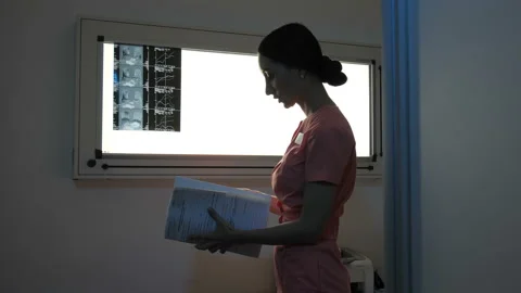 Doctor examining an X-ray Video stock 95489342