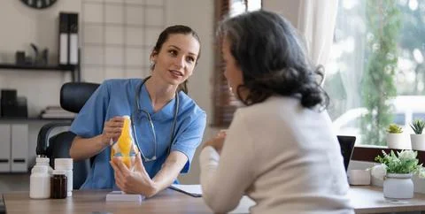 Doctor explain about back bone issue to fat woman patient. Health care and Stock Photos
