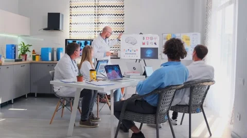 Doctor explaining brain biohacking with pointer at medical seminar Stock Footage 316293546