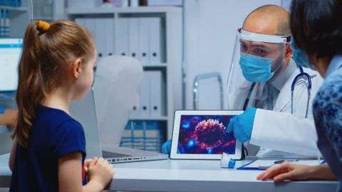 Doctor explaining evolution of virus Stock Photos