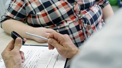 Doctor Explaining Glucose Test to Obese Patient Stock Footage 88698483