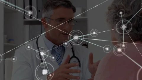 Doctor explaining health data with node network spreading across frame while Stock Footage 312712872