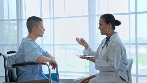 A doctor is explaining medication instructions to a female patient Stock Footage 339061697
