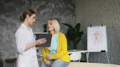 Doctor explaining treatment plan to upset patient, risk of serious illness Stock Footage 320119671