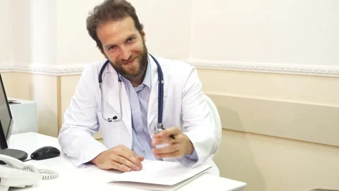 Doctor explaining X-Ray results to young female patient Stock Footage 311989967