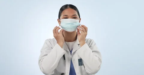 Doctor, face mask and tutorial of woman with thumbs up for covid and disease 動画素材 251974548