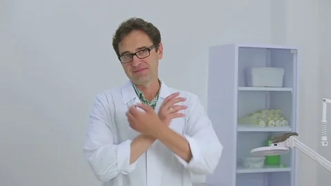 Doctor friendly looking into the camera Stock Footage 70511784