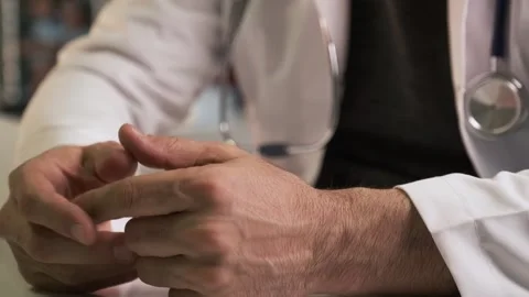 Doctor Gesturing and Explaining Medical Diagnosis Stock Footage 332330478