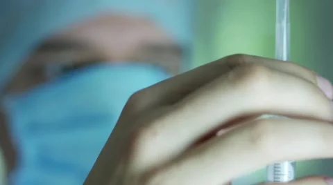 Doctor getting ready to make an injection to the patient Stock Footage 67496501