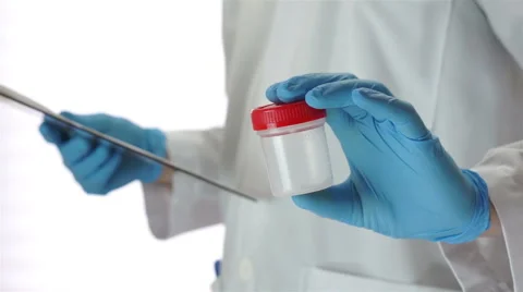 Doctor Gives Pee Sample Cup Stock Footage 44676454