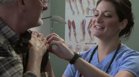Doctor giving patient a shot Stock Footage