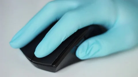Doctor in gloves working with mouse Stock Footage 79786526
