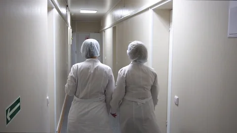 Doctor goes down the hall in the operating unit Video stock 110810821