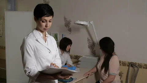 Doctor is going through the documents Stock Footage 91626477