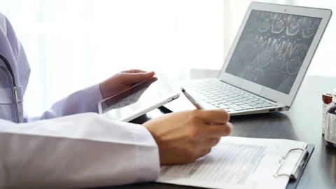 Doctor GP filing a document in an office. and healthcare concept. and hands Stock Footage 336587770