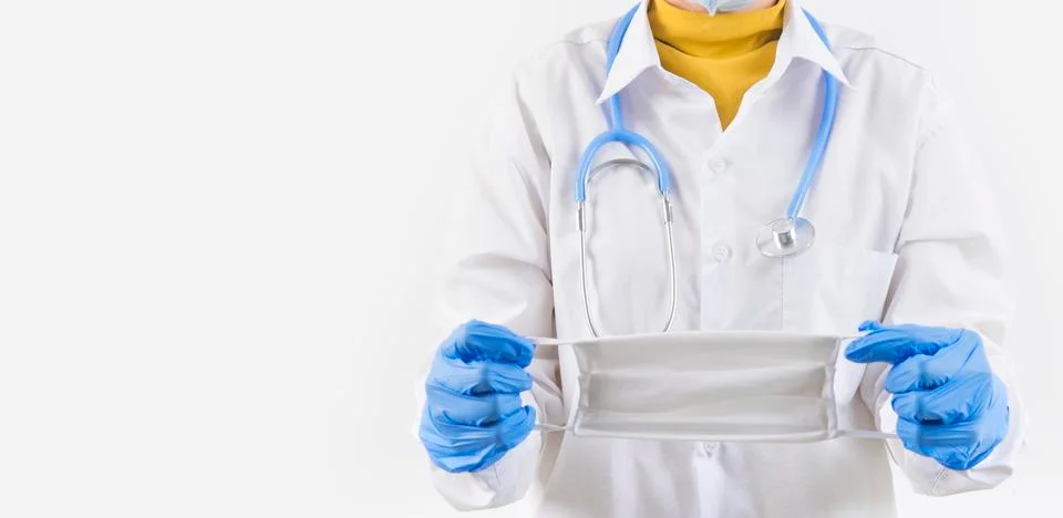 Doctor hand holding a dust mask, 2.5 isolate on a white background. Promoting Stock Photos