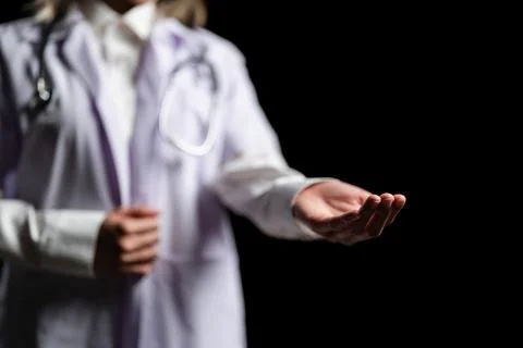 Doctor hand holding empty virtual object for text or product. copy space Stock Photos