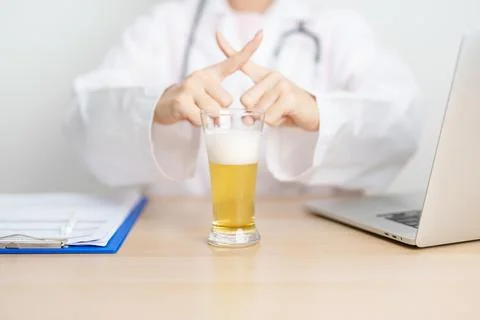 Doctor hand stop to refuse Beer, quitting drink for healthy liver, prevent .. Stock Photos