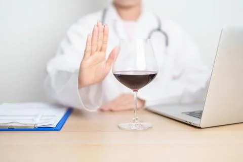 Doctor hand stop to refuse Wine, quitting drink for healthy liver, prevent .. Stock Photos