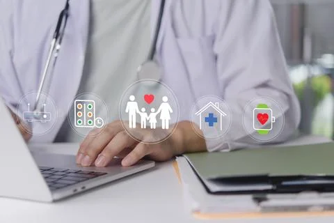 Doctor hand using laptop computer with family health insurance care. Medica.. 库存照片