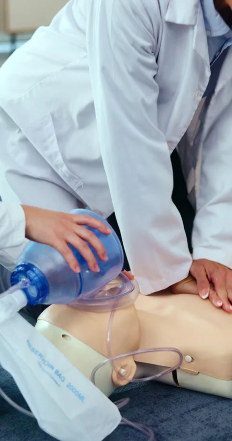Doctor, hands and dummy for cpr training at hospital for demonstration workshop, Stock Footage 338224045