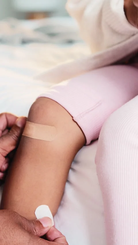 Doctor, hands and kid with knee bandage on bed for bruise, medical injury or Stock Footage 335893473