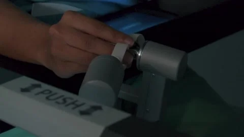 DOCTOR HANDS OPERATING THROUGH A PRECISION SURGERY MACHINE Stock Footage 201741586