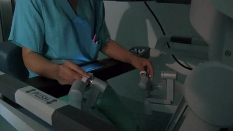DOCTOR HANDS OPERATING THROUGH A PRECISION SURGERY MACHINE Stock Footage 201741600