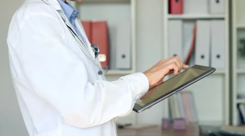 Doctor hands with tablet computer in the office HD Video stock 8849156