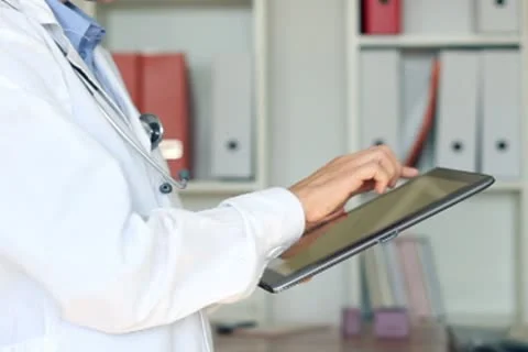 Doctor hands with tablet computer in the office NTSC Stock Footage 8849161