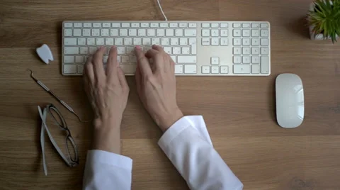Doctor hands typing on keyboard Stock Footage 65145996