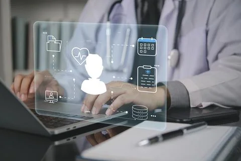 Doctor hands typing laptop computer patient profile icon virtual screen. Ho.. Foto stock