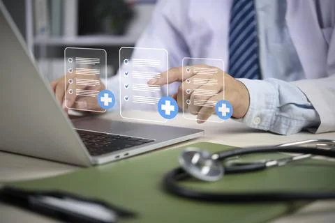 Doctor hands using laptop accessing electronic medical record system digita.. Stock Photos