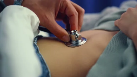 Doctor hands using stethoscope closeup. Kid in pediatric clinic emergency room. Stock Footage 172567353