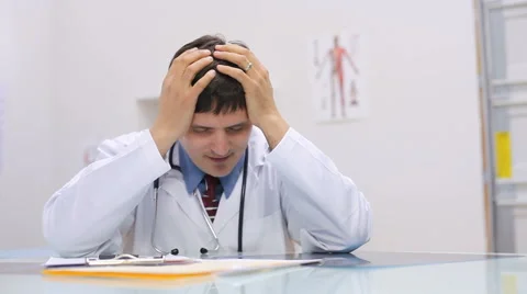 Doctor having a headache Stock Footage 61654047