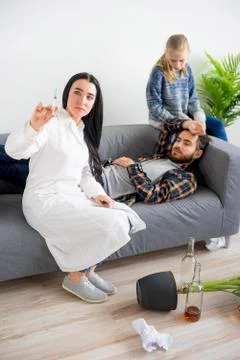 Doctor helping an alcoholic Stock Photos