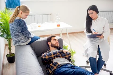 Doctor helping an alcoholic Stock Photos