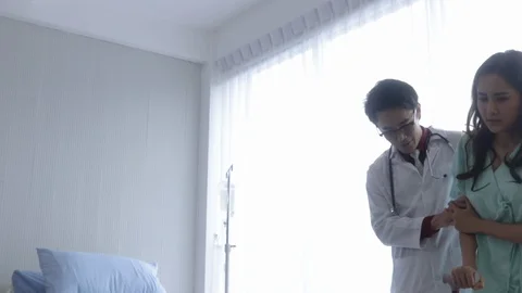 The doctor helping to support the patient for walking. Stock Footage 128818609