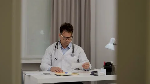 Doctor in his office Video stock 197708152