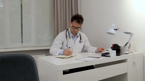 Doctor in his office Stock Footage 201213790