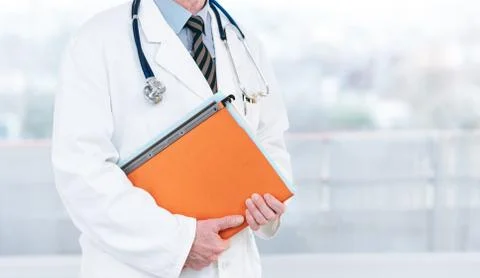 Doctor holding a folder 스톡 사진