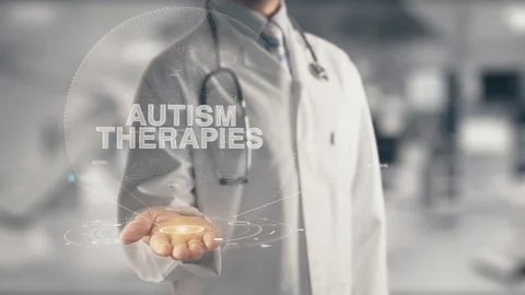 Doctor holding in hand Autism Therapies Stock Footage
