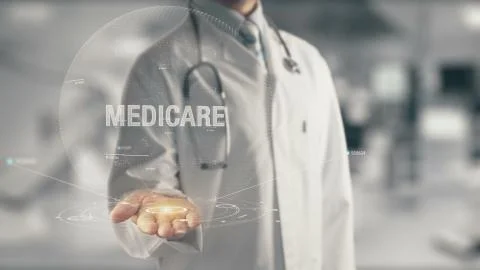 Doctor holding in hand Medicare Stock Photos