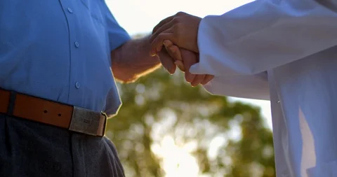 Doctor holding a mans hand. 스톡 동영상 88372102