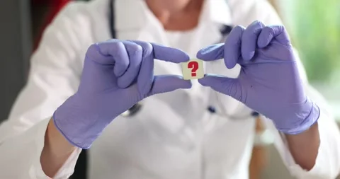 Doctor holding question icon. Frequently asked questions about medicine Stock Footage 209946053
