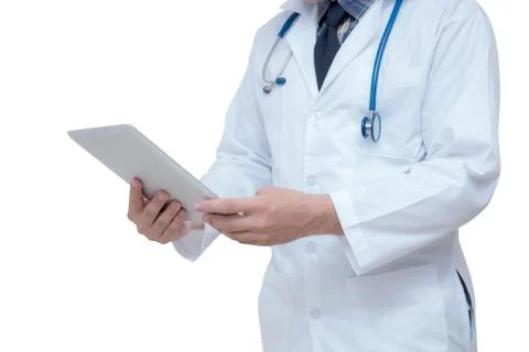 Doctor holding a tablet computer while using it isolated on white background Stockfoto's