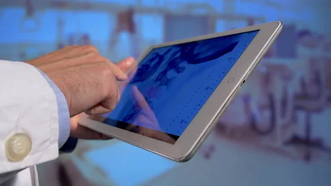 Doctor holding a tablet  Stock Footage 162354560