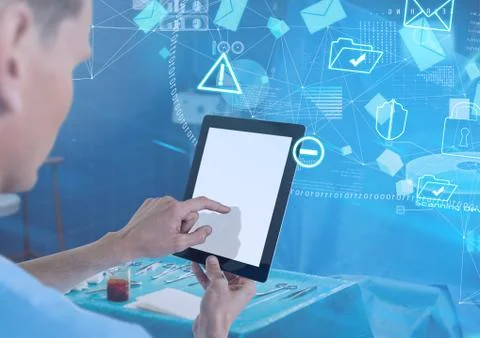 Doctor holding tablet with interface in surgery room Foto stock